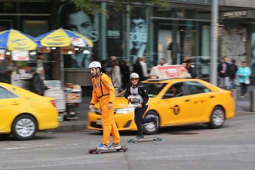 silask-broadway-bomb silask longboarding in the broadway bomb in front of an nyc taxi